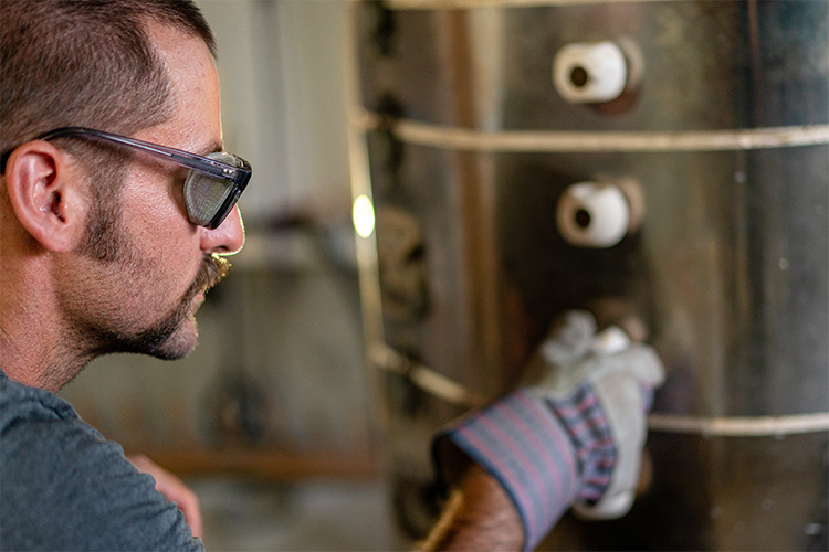 Steamboat Springs potter Converse Fields adjusting kiln