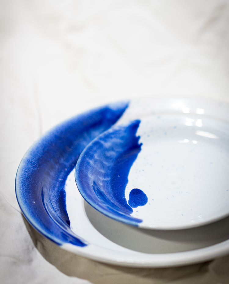 white and blue stoneware dinner set by potter Converse Fields