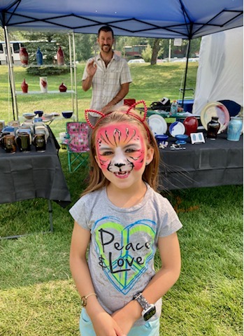 Adeline Fields with painted cat face at Steamboat Springs Arts Festival