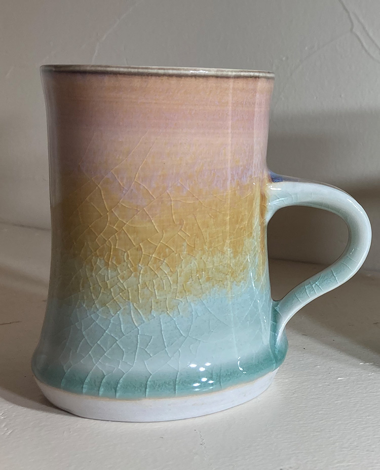 multi colored porcelain mug in desert rose, gold, celadon glaze by Converse Fields for Fields Pottery