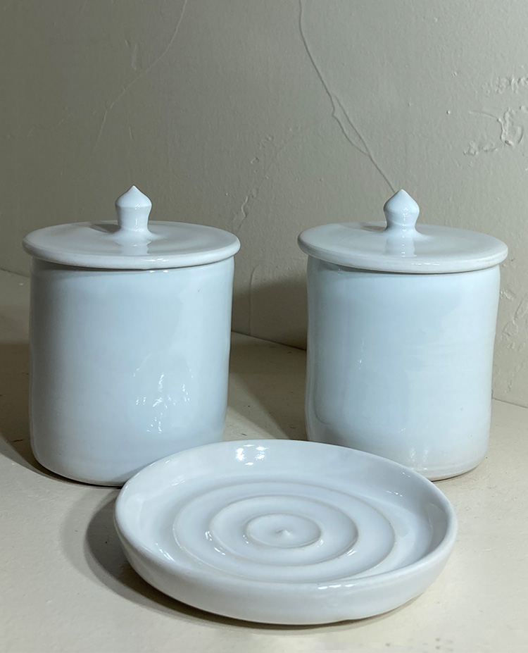 two toiletries containers with covers and soap dish in porcelain hand thrown by Converse Fields for Fields Pottery