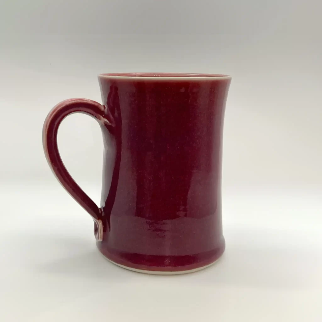 coffee mug ceramic in deep red hand thrown by Converse Fields Pottery in Terrebonne Oregon