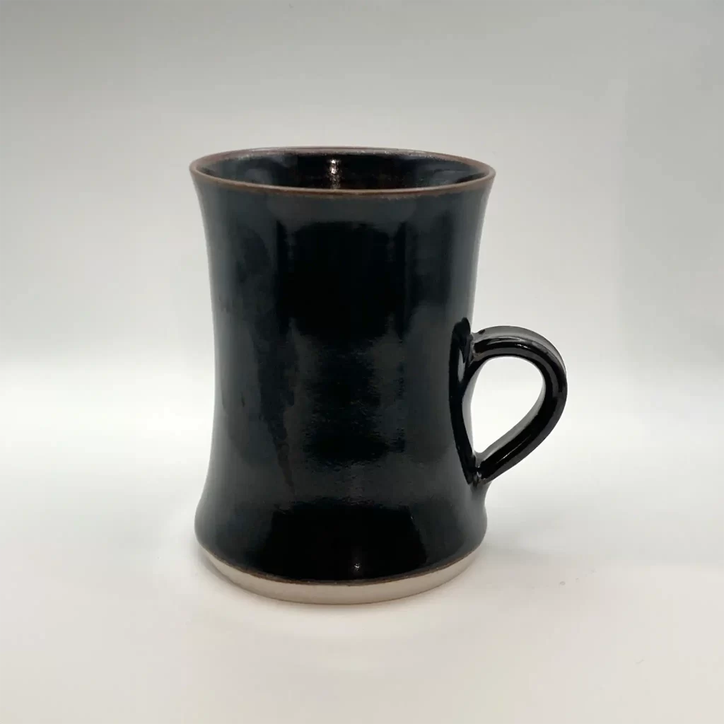 ceramic coffee or tea mug handmade tenmoku glaze hand thrown by Converse Fields Pottery in Terrebonne Oregon